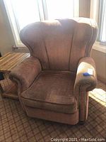 Front view of Marshf II wingback armchair showing textured reddish-brown fabric upholstery and cushioned seat.