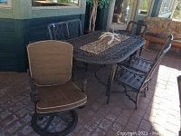 Overall view of oval table with chairs, bench and antler candle holder