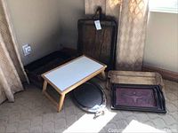Overall view of nine pieces including basket, boards, bed tray, metal and leather trays