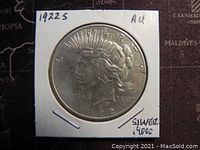 Front side of the 1922S US Silver Peace Dollar showing Lady Liberty profile, marked AU condition, 90% silver.