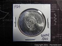 Reverse side showing the floral centennial design with dates 1867-1967 and inscription 'CANADA DOLLAR'.