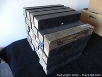 Decorative cardboard boxes stacked containing the piano rolls, showing their aged yet intact condition.