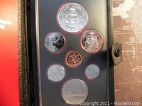 Front view of the coins in the proof set showing the reverse design images including the double dollar with sailboat and maple leaf.