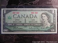 Front side of 1967 Canadian Centennial one dollar banknote showing Queen Elizabeth II portrait and denomination details.