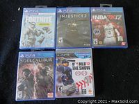 Photo showing all five games with visible covers and packaging.