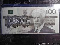 Front side of the 1986 Canadian $100 banknote showing portrait, denomination, and signatures.