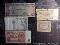 Five banknotes laid out showing front sides including $1 Bank of Jamaica and 1000 Saudi Riyals with Arabic script among others.