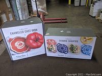 Boxed new 2 QT Martha Stewart enameled cast iron casserole and boxed set of 4 Martha Stewart ceramic cocottes in original packaging.