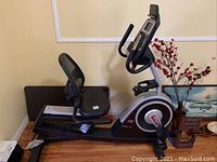 Side view of Pro-Form 440 ES recumbent exercise bike showing frame, seat, pedals