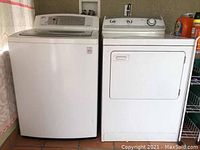 Front view of white LG washer and Maytag dryer side by side