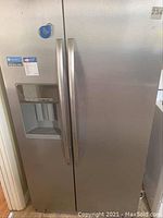 Front-facing view of stainless steel side-by-side refrigerator freezer exterior.