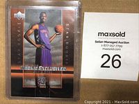 Front view of Chris Bosh rookie basketball card in protective plastic case showing player in Toronto Raptors uniform and all card details.