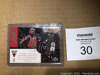 Front image showing Michael Jordan in Chicago Bulls uniform mid-shot and portrait with branded design and quote.