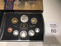 Full display of all eight coins in proof set inside black display case with gold labelling for Royal Canadian Mint.