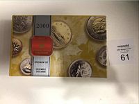 Photo of original outer packaging showing '2000 Specimen Set' with images of coins.