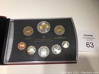 Front view of the full 2005 Royal Canadian Mint proof set in protective casing showing all coins including Toonie, Loonie, 50c, 25c, 10c, 5c and 1c.