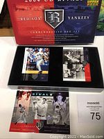 Box set in black and red case with 32 cards including a variety of baseball stars.