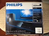 Box of the Philips HTL2160 Bluetooth Soundbar showing brand, image of product, and Bluetooth feature.