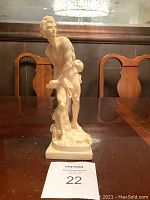 Front and side views of a 10 inch A. Santini David statue on a wooden table, showing detailed sculpture and condition.