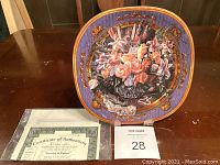 Front view of the Bradford Exchange decorative plate with floral artwork and certificate of authenticity.