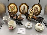 Photo showing the full assortment of vintage and used decorative items including wooden plaques, ceramic animal figurines, ceramic pitchers, and trinket boxes.