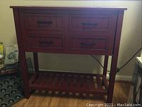 Full view of the four drawer wooden server with visible drawers and slatted lower shelf.