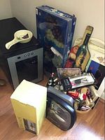 Overview of all lot items arranged on floor next to wall