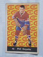 Front of 1961 Parkhurst Phil Goyette rookie card showing player in Canadiens uniform. Yellow background with repeated Canadiens logo.