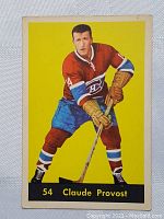 Front of 1950s Parkhurst hockey card showing Claude Provost in Montreal Canadiens uniform, card number 54, yellow background.