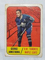 Front of vintage 1960s Parkhurst NHL trading card showing George Armstrong in Toronto Maple Leafs uniform with captain's 'C'.