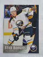 Front of Jack Eichel rookie card showing him in Buffalo Sabres white uniform on ice with hockey stick, with Star Rookies branding and Upper Deck logo.