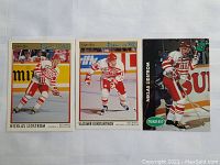 Three hockey cards: Nicklas Lidstrom and Vladimir Konstantinov in Red Wings uniforms from 1991 including O-Pee-Chee Press Pass '92 and Parkhurst cards.