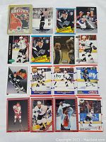 Photo of 15 assorted Wayne Gretzky hockey cards featuring various brands and years.