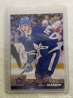 Front of 2016 Upper Deck Mitch Marner rookie card showing player in Leafs uniform and card logos.