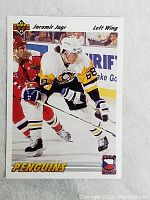 Front of the 1990 Upper Deck Jaromir Jagr rookie hockey card featuring in-action photo and team details.