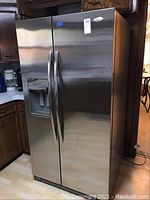 Front view of closed refrigerator showing stainless steel finish