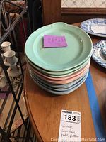 Stack of 11 Lu-Ray pastel ceramic platters in pastel green, pink, and blue colors.