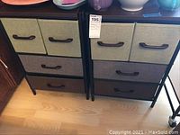 Two identical storage units side by side on hardwood floor.