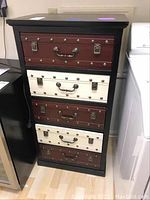 Angled front view of entire chest with drawers closed.