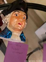 Close-up image of one George Washington Christopher Radko Christmas ornament bust, showing detailed face and colonial attire.