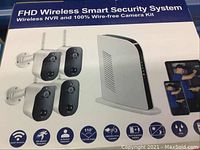 Retail box showing FHD Wireless Smart Security System kit with two cameras and NVR dock