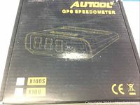 Box of AUTOOL X100S GPS Speedometer with model branding and specifications.