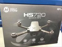 Original Holy Stone HS720 packaging box showing model, branding, and key features