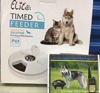 Box of Elife Timed Feeder featuring image of cat and dog, showing product on front with brief product details
