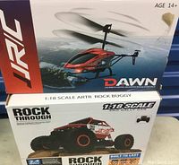 Original boxes of the helicopter and rock buggy, showing branding and models
