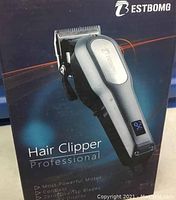 Box showing Bestbomg Professional Hair Clipper with highlights of features such as most powerful motor, cordless, overlapped blades.