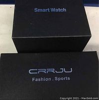 Boxes for the two watches: one labeled Smart Watch, one CRRJU Fashion Sports