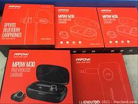 Five Mpow product boxes including M30 True Wireless Earbuds and Sports Bluetooth Earphones.
