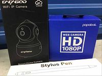 Dahuagoo WiFi IP Camera box, Papalook HD 1080P Web Camera box, Stylus Pen box shown together