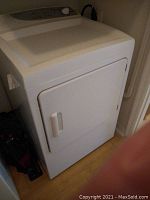 Front right angled view of the white dryer showing door and cabinet.